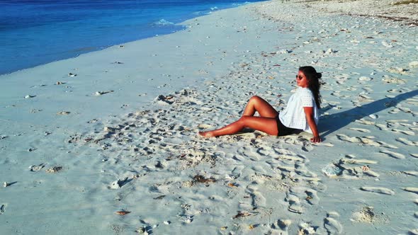 Girls look beautiful on tranquil lagoon beach adventure by blue green sea and white sand background 