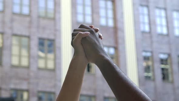 Anti Racism Symbol. Black and White Hands Clenched Together in a Fist in Protest Against the