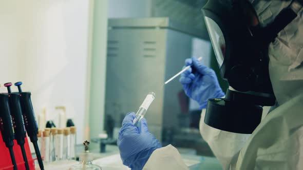 Laboratory Worker Uses Pipette While Working with Coronavirus Sample