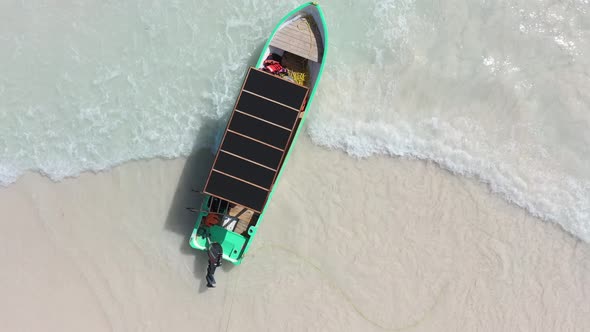 Aerial Top Down View of a Fisher Boat Moored on the Beach