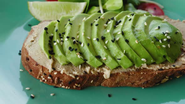 Closeup Delicious Avocado Toast with Salad on Plate