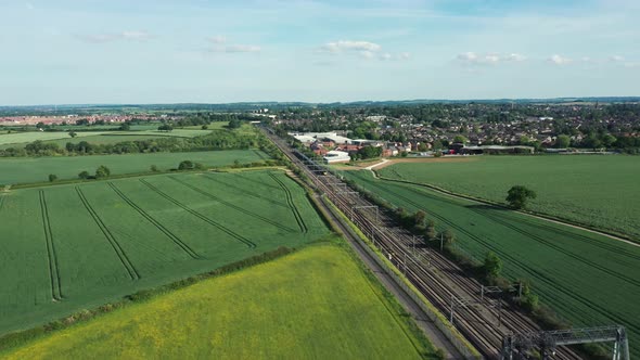 Railway in the countryside and trains passing, aerial view