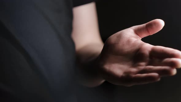 Close-up treatment of hands with alcohol spray