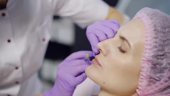 Lip Augmentation. Woman Getting Beauty Injection For Lips