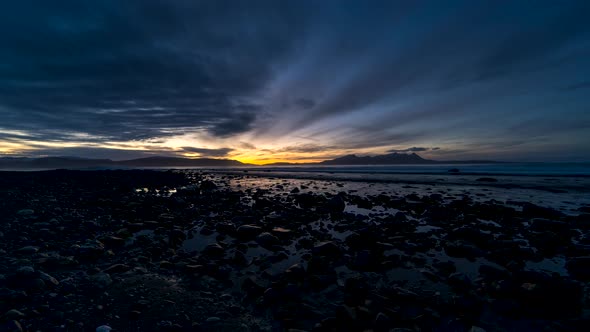 Vivid coastal sunset timelapse with interesting cloudement in sky