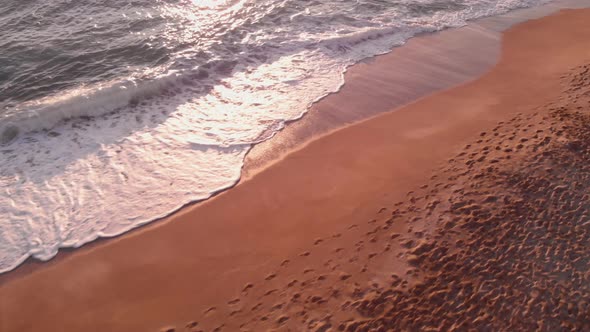 Sea waves and sunset beach