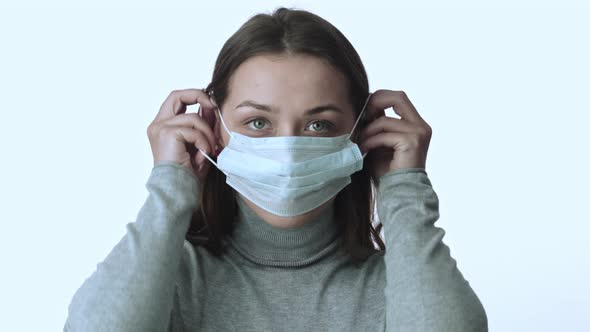 Girl Puts on Medical Mask Against 2019-Ncov, Quarantine, Coronavirus Outbreak