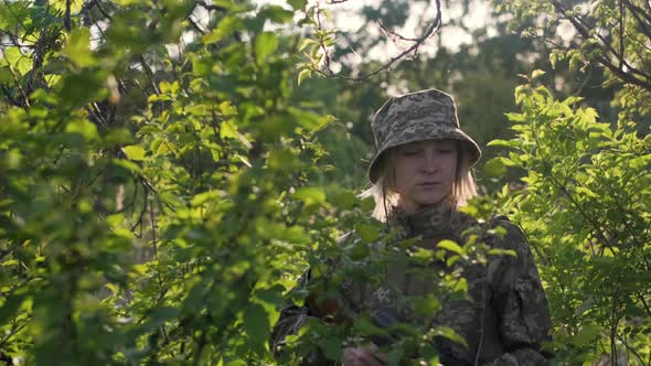 Ukrainian Female Soldier Armed with an Assault Rifle Patrols a Combat Zone