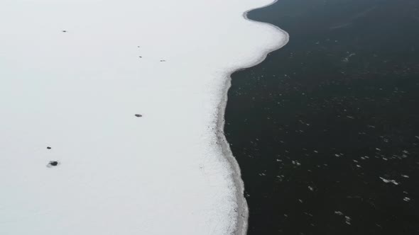 Ice Covered Landscape In Birds Island In Winter - aerial shot