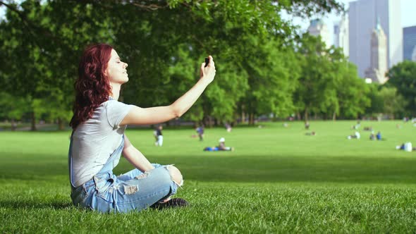 Smiling woman doing selfie