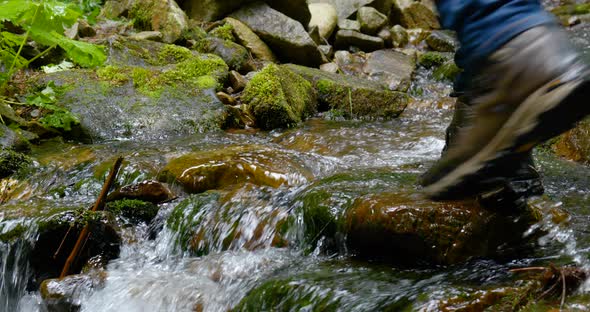 Closeup of Vintage Leather Hiking Boots Hiker Rolling Mountain Stream