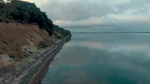 Aerial view of a beach with quiet water