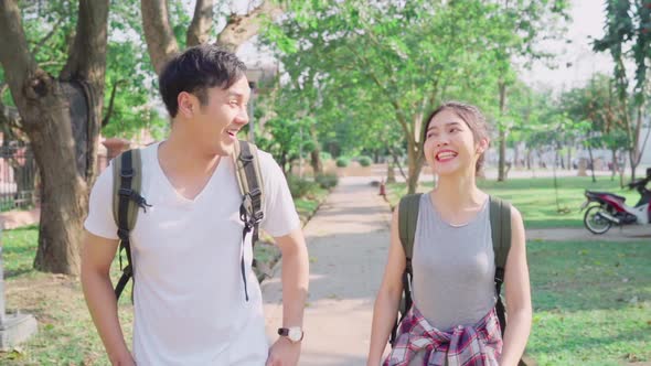 Traveler Asian couple traveling and walking in Bangkok, Thailand.