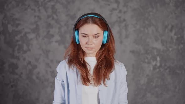 Face Young Red Headed Female with Earphones Front View