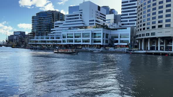 Small boat crusing along the Yarra River in Melbourne.