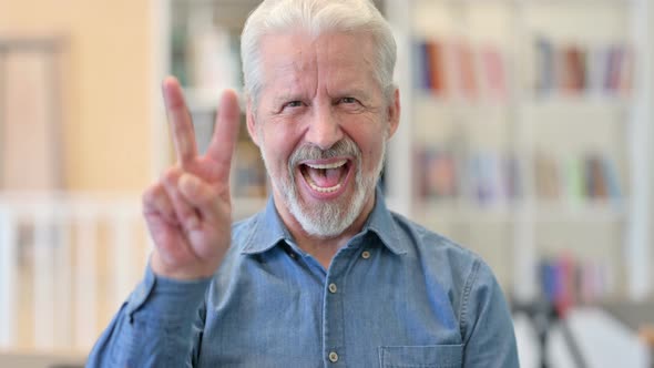 Old Man Showing Victory Sign