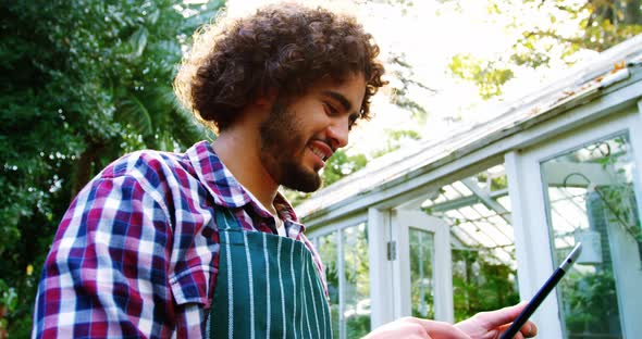 Happy man using digital tablet