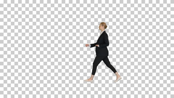 Gorgeous blond fashionable businesswoman walking by, Alpha Channel