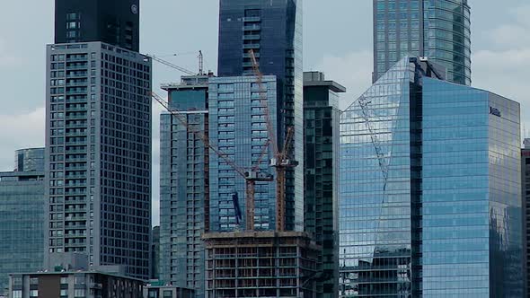 Cool time lapse of Montreal skyline with construction cranesing.