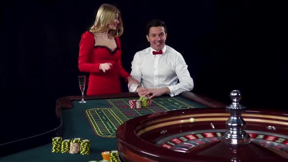 Couple Playing Roulette Wins at the Casino Club