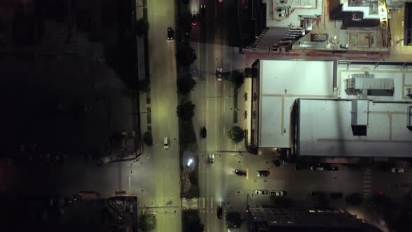 Birds Eye View On Downtown City Streets Alive With Cars Driving At Night