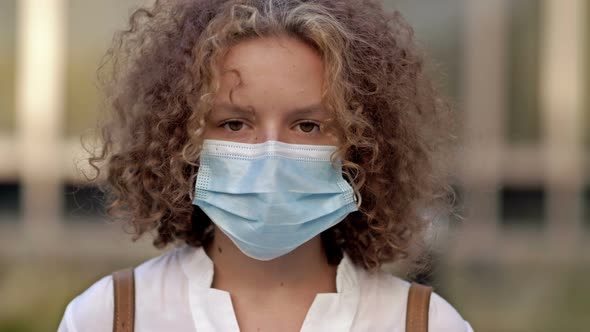 Portrait of a Schoolgirl in a Protective Mask