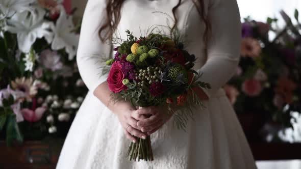 Crop bride with beautiful bouquet