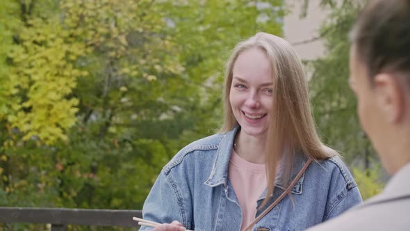 Blond girl having break for dinner outside