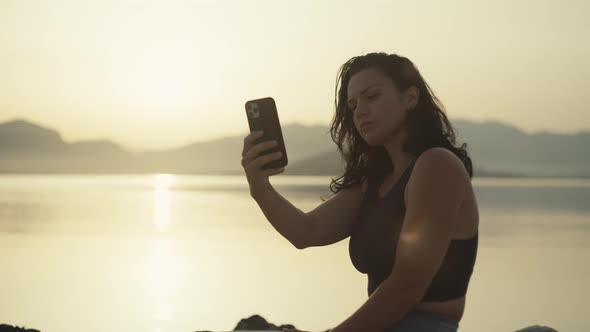 Girl After a Morning Jog Makes a Selfie on the Phone