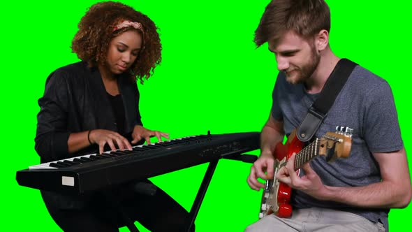 Musicians playing piano and guitar