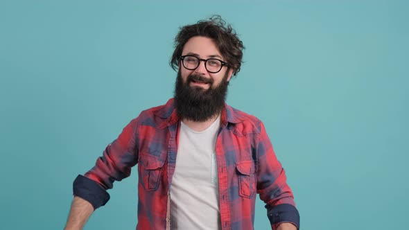 Gift Delivery. Close Up of a Smiling Man Offering Wrapped Box To Camera