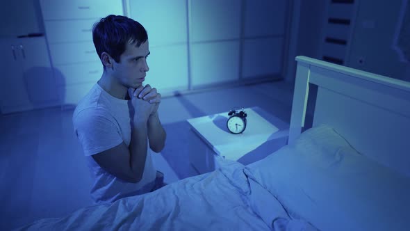 A Man Praying Before Going to Bed
