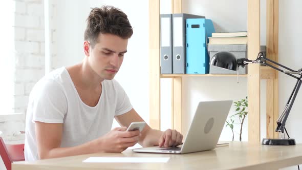 Creative Man Using Smartphone, Text Messaging