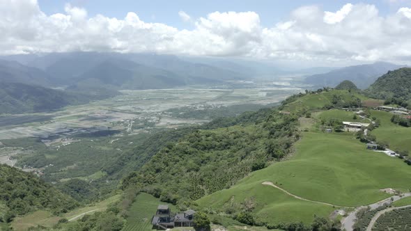 Aerial video from flying a drone over a small village in the high mountain forest.