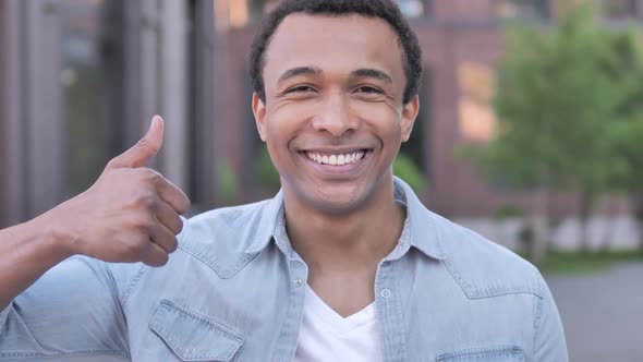 Thumbs Up By African Man Outdoor