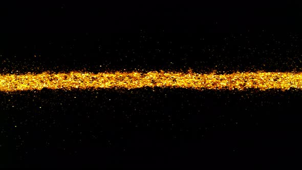 Super Slow Motion Shot of Golden Glitter Line Isolated On Black Background at 1000 Fps