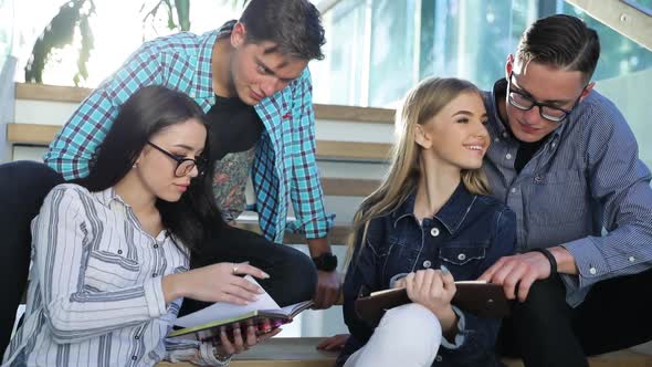 Students Studying, Reading Educational Book In College