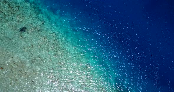 Beautiful aerial abstract view of a sandy white paradise beach and aqua blue water background in bes