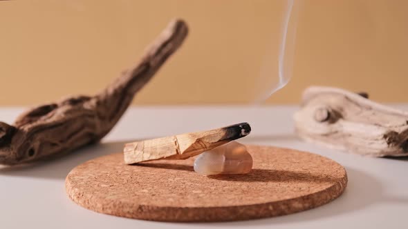 Peruvian palo santo holy wood smoke smolders. Esoteric objects for meditation, antistress