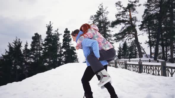 Two Happy Girls in Winter Clothes are Having Fun in Snow Joyful Women Play Funny