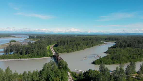 4K Drone Video of Alaska Railroad Train Trestle with Mt. Denali in Distance during Summer