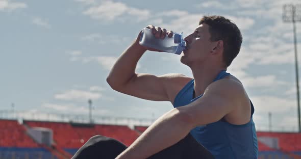 Runner Drinking Water During Break