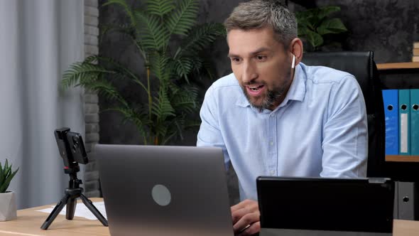 Excited Businessman Winner Celebrating Good Business Deal in Office