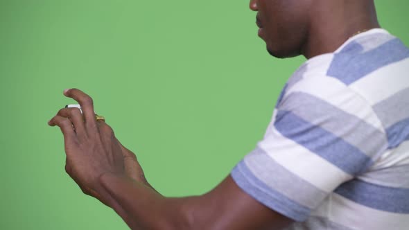 Young African Man Using Phone