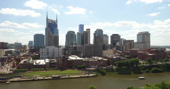 Nashville, Tennessee skyline with drone video moving down.