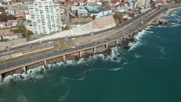 Aerial View Of Vehicles Driving On Avenida España With Viña del Mar City In Chile. - pullback