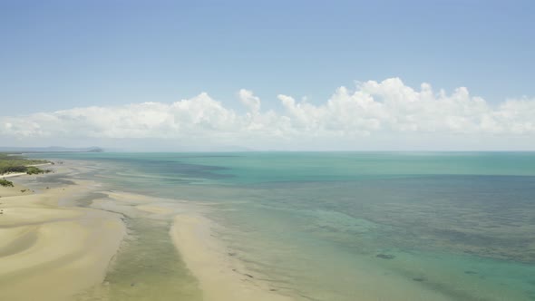 Aerial, Low Tide And Huge Sand Ocean Bed And Mangroves Growing In Queensland Australia