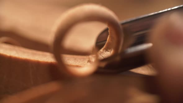 Extremely Close Up of Man’s Hands doing Artistic Wood Carving.