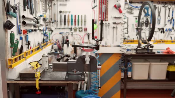 Rack with bicycle fork near tools