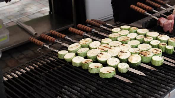 Zucchini Grilled on Skewers on the Open Barbecue at Food Court Vegan Shashlik